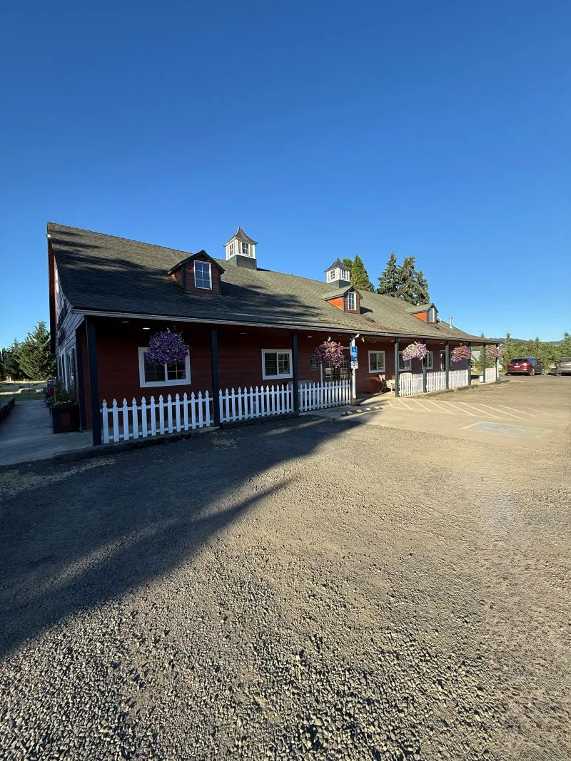 The clinic's long red barn and gravel lot on Elliott Circle, north of Corvallis