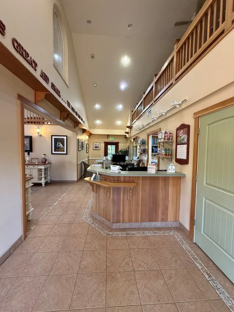 The reception desk and hallway under the barn's open loft